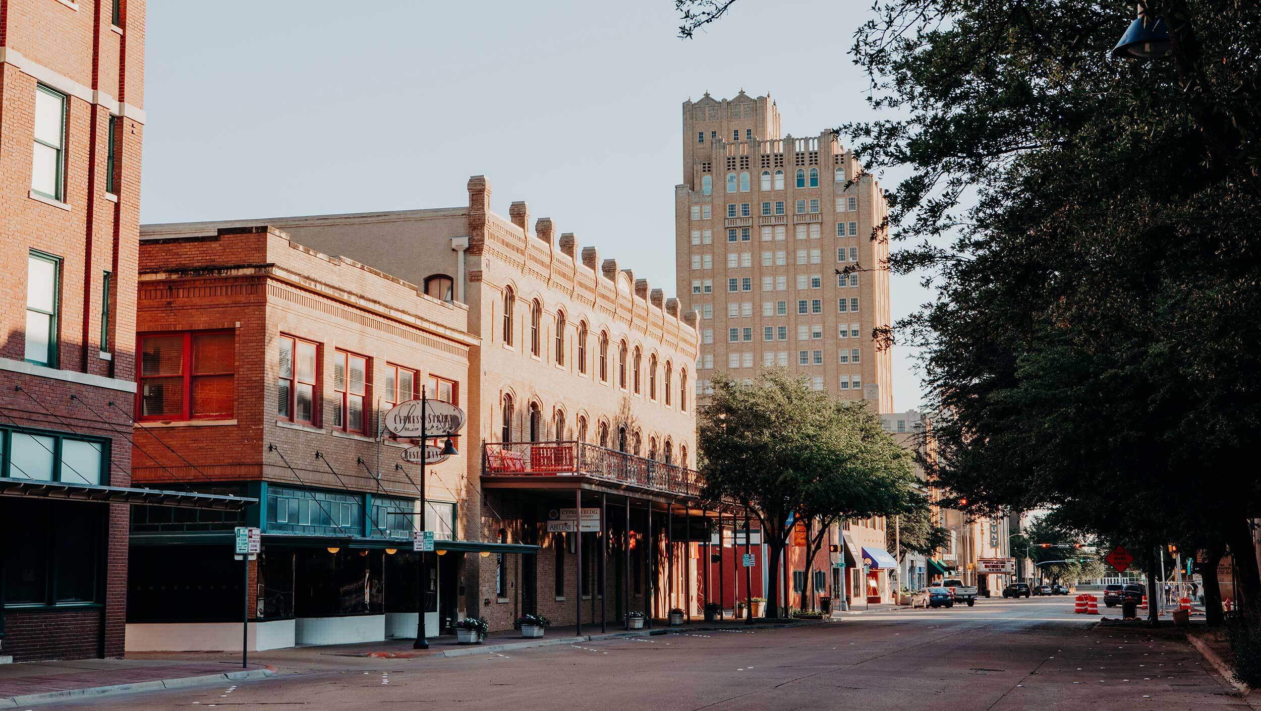 Cypress Street in downtown Abilene, Texas is lined with trees, small business buildings, and shops