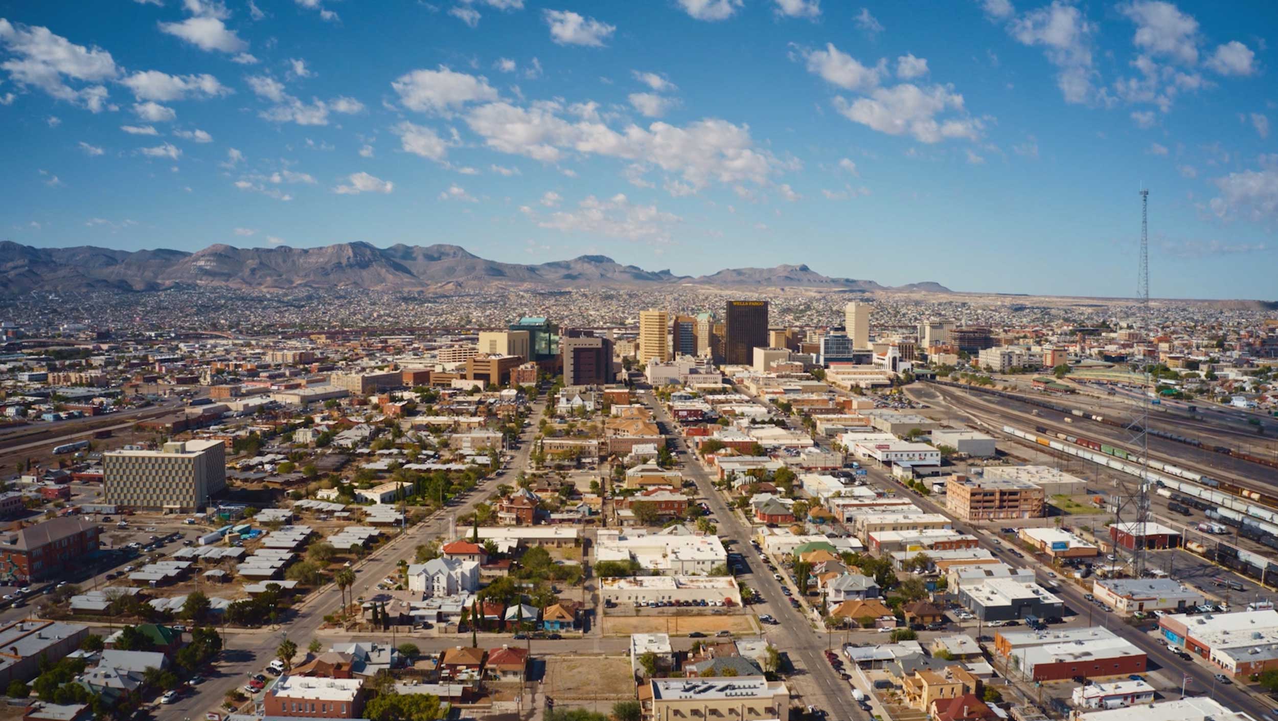 Aerial view of El Paso, Texas, with small residential buildings and large business buildings