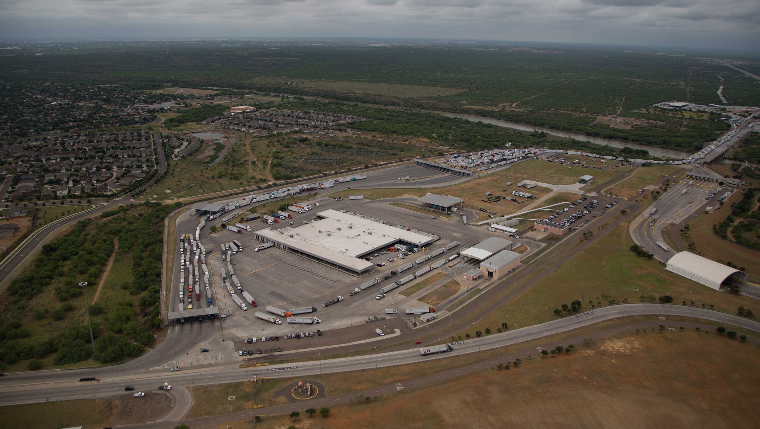 Aerial view of cars driving on a highway through a rural area