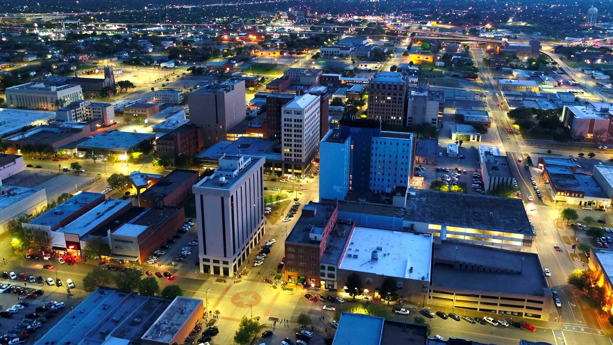 Aerial view of downtown Wichita Falls lit up at night