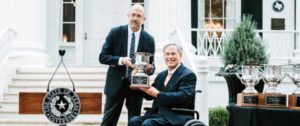 Governor Greg Abbott holding the 8th consecutive Site Selection Magazine's Governor's Cup Award 