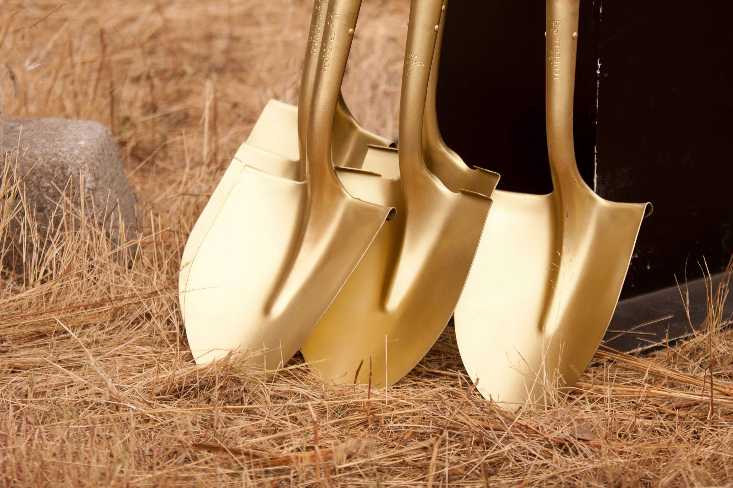 Multiple golden shovels waiting for ground breaking ceremony