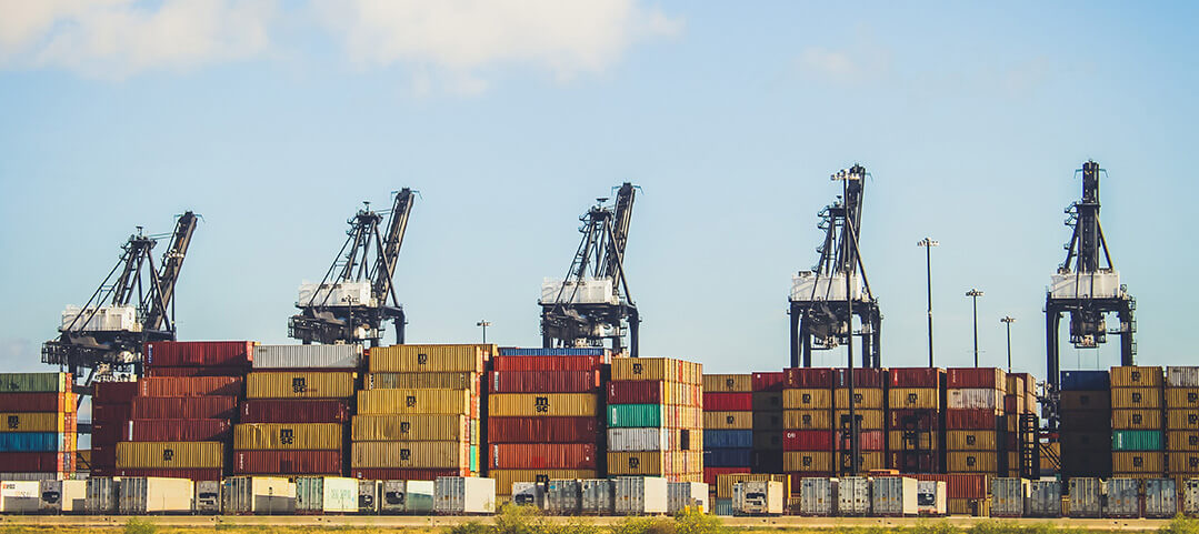 photo of shipping containers at a port